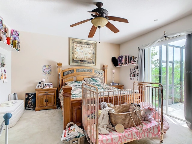 carpeted bedroom with access to outside and ceiling fan