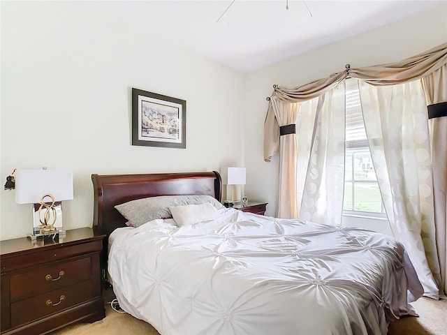 bedroom featuring light colored carpet