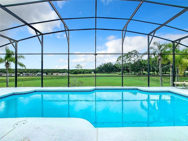 view of swimming pool with glass enclosure