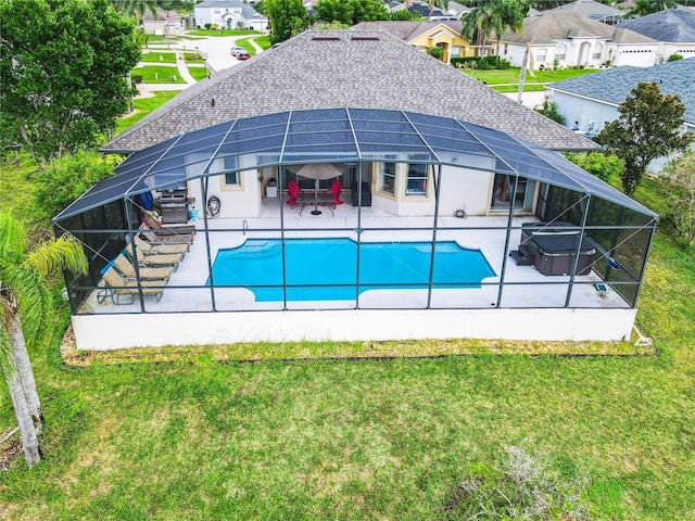 139 Belfry Dr, Davenport, FL 33897 - swimming pool featuring a patio area, glass enclosure, a lawn, and a residential view