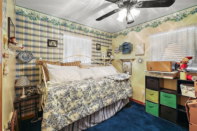 bedroom with ceiling fan and carpet floors