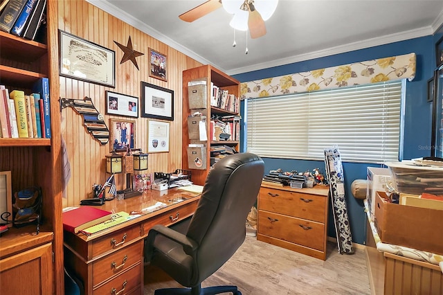 office area featuring light wood-type flooring, crown molding, wood walls, and ceiling fan