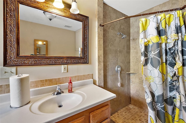 bathroom with vanity and curtained shower