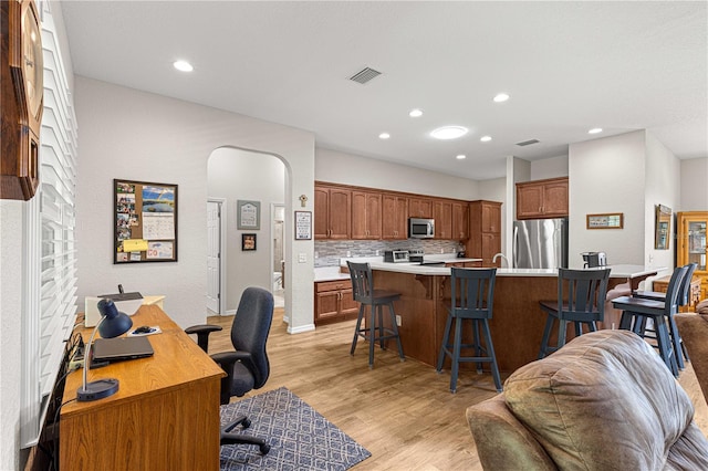 home office featuring light hardwood / wood-style flooring