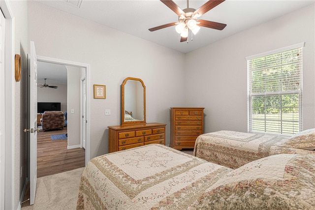 bedroom with light wood-type flooring and ceiling fan