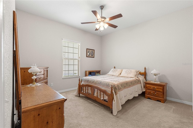 bedroom with ceiling fan and light colored carpet