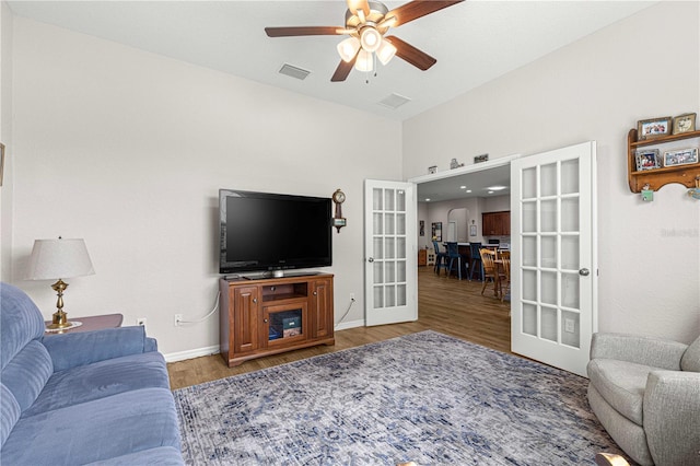 living room with french doors, hardwood / wood-style floors, and ceiling fan