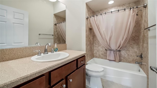 full bathroom featuring shower / bath combo, vanity, and toilet