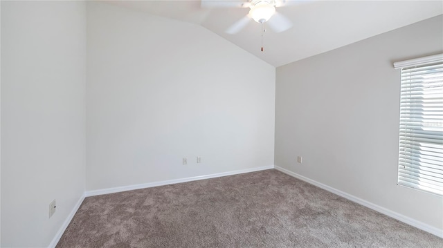 carpeted empty room featuring ceiling fan and lofted ceiling