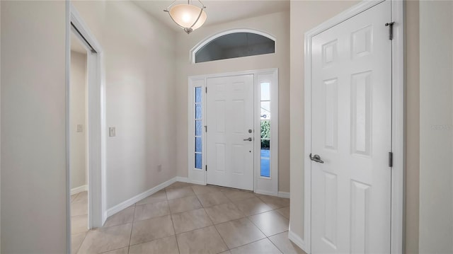 foyer entrance featuring light tile patterned flooring