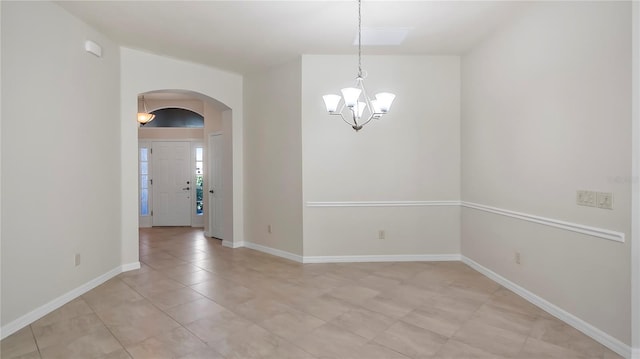 unfurnished room featuring light tile patterned floors and a chandelier