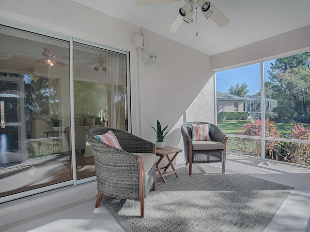 sunroom / solarium with ceiling fan