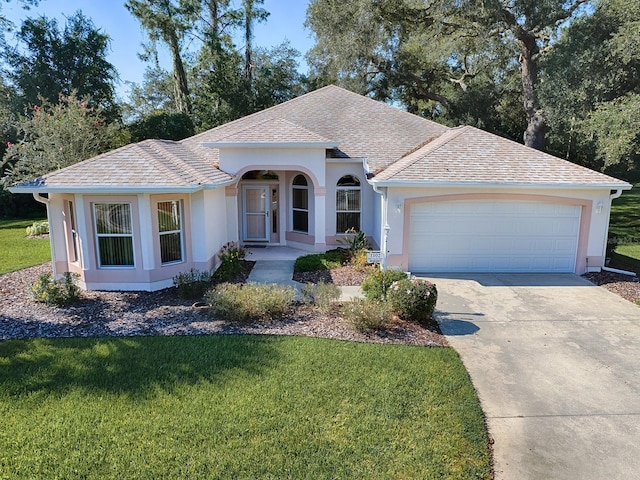 ranch-style house with a front yard and a garage