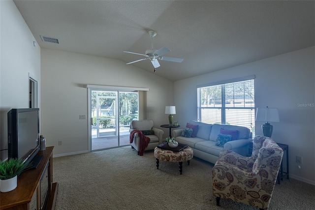 living room with carpet floors, ceiling fan, and vaulted ceiling