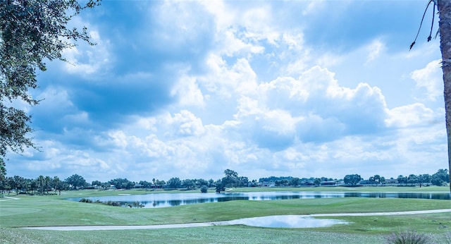 view of home's community featuring a yard and a water view