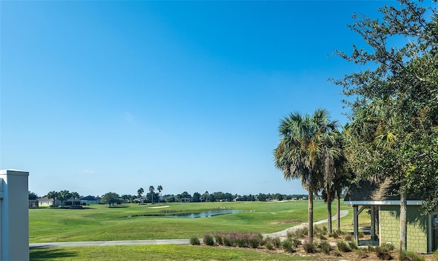 view of community featuring a water view and a lawn