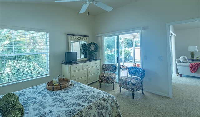 bedroom with light carpet, access to exterior, vaulted ceiling, and ceiling fan