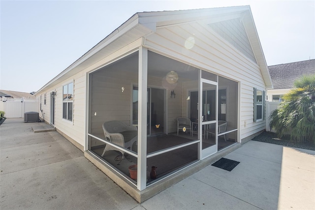 exterior space featuring a sunroom and a patio area