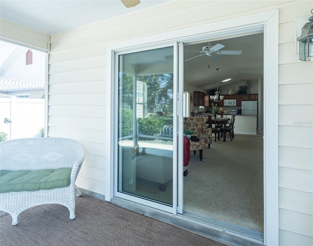 exterior space with ceiling fan