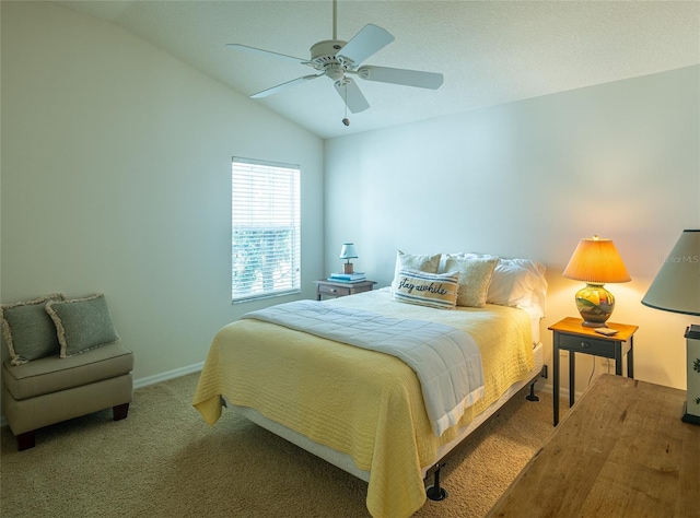 carpeted bedroom with vaulted ceiling and ceiling fan