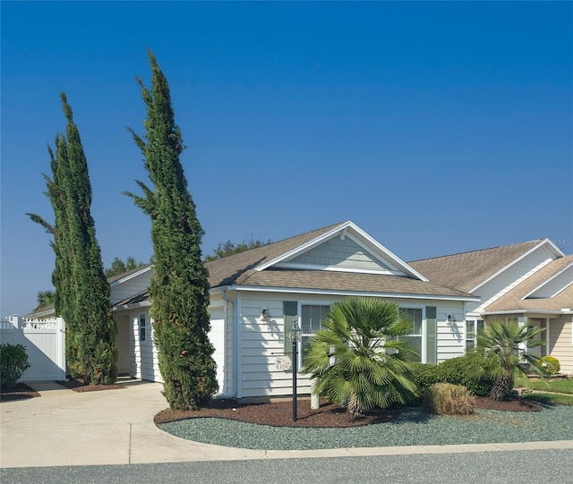 ranch-style home featuring a garage