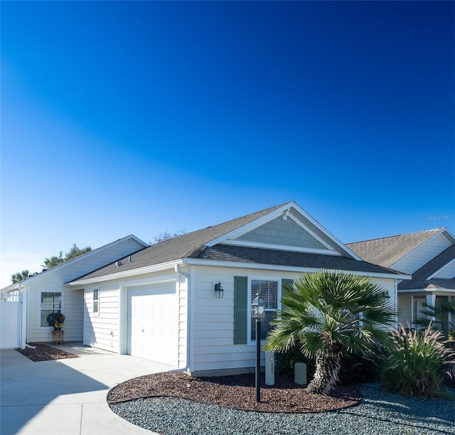 single story home featuring a garage