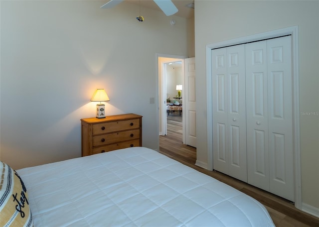 bedroom featuring hardwood / wood-style flooring, a closet, and ceiling fan