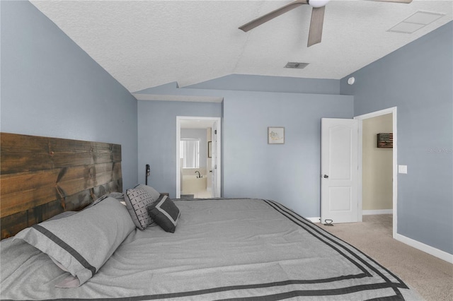 bedroom with vaulted ceiling, ceiling fan, carpet floors, and a textured ceiling