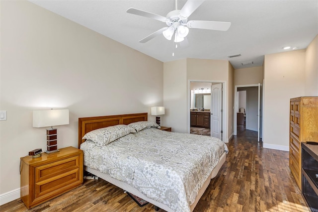 bedroom featuring ceiling fan, connected bathroom, and dark hardwood / wood-style flooring