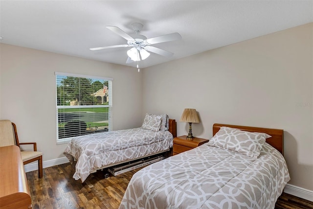 bedroom featuring dark hardwood / wood-style floors and ceiling fan