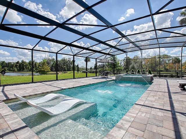 view of pool with an in ground hot tub, pool water feature, a patio, and a lanai