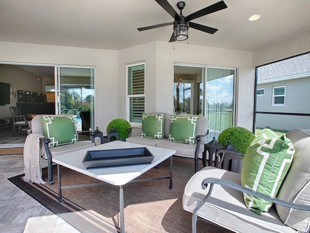 view of patio / terrace with an outdoor living space and ceiling fan