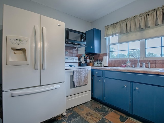 kitchen featuring blue cabinetry, backsplash, sink, and white appliances