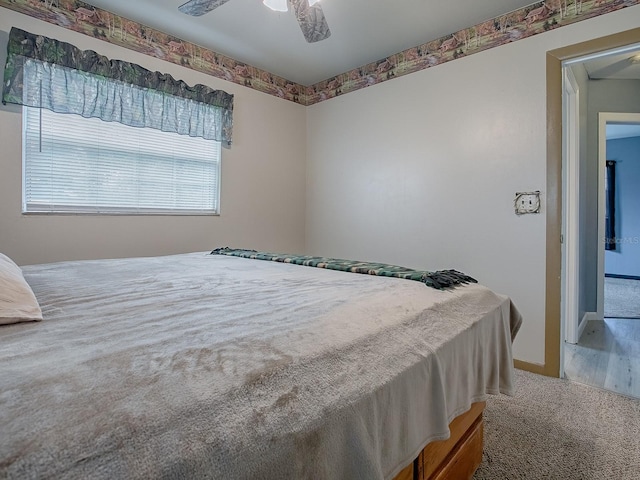 bedroom with ceiling fan and carpet floors