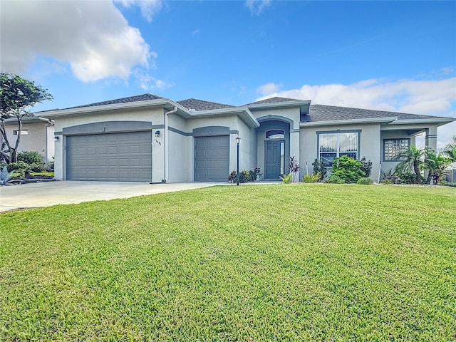 view of front of home with a garage and a front lawn