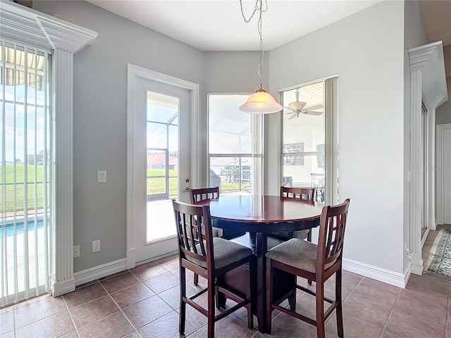 tiled dining area featuring ceiling fan and a healthy amount of sunlight