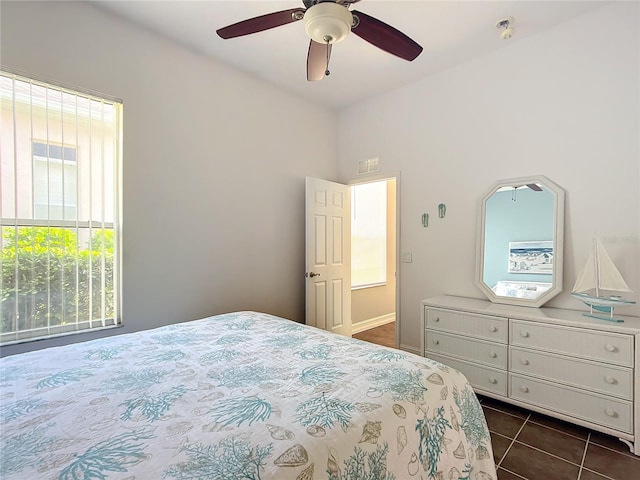 tiled bedroom with ceiling fan