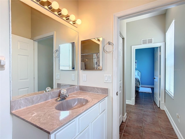 bathroom featuring tile patterned floors and vanity