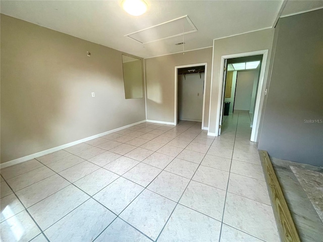 unfurnished room with light tile patterned floors