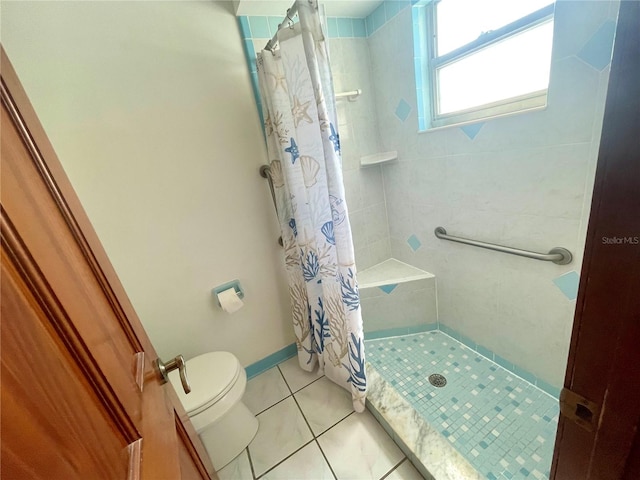 bathroom with tile patterned floors, a shower with shower curtain, and toilet