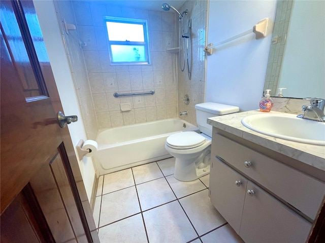 full bathroom with tiled shower / bath, vanity, tile patterned flooring, and toilet