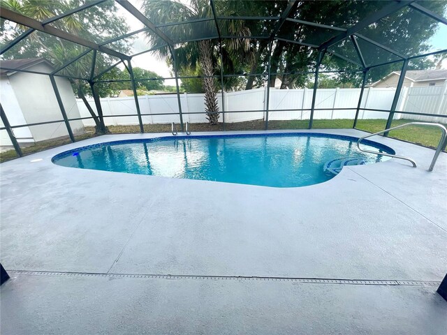 1415 Harnden Rd W, Port Orange, FL 32129 - view of pool featuring a patio, a fenced backyard, and a lanai