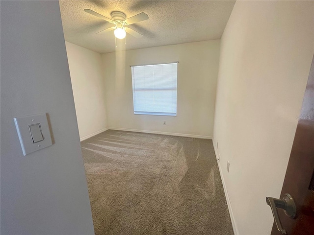 1415 Harnden Rd W, Port Orange, FL 32129 - carpeted spare room featuring a ceiling fan, a textured ceiling, and baseboards