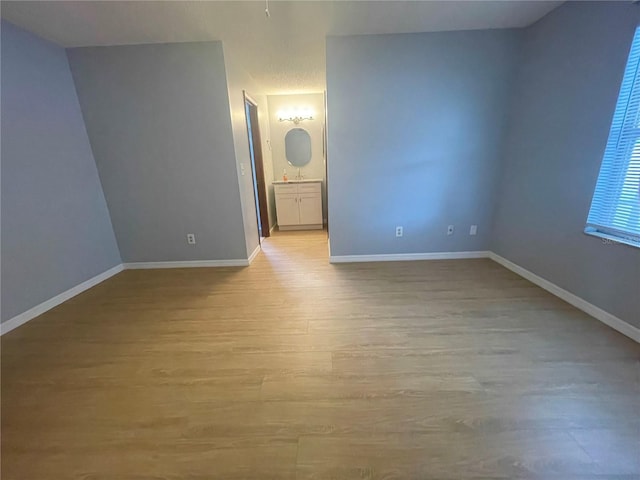 1415 Harnden Rd W, Port Orange, FL 32129 - spare room with light wood-type flooring and baseboards