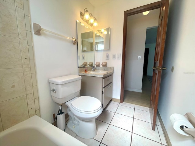 1415 Harnden Rd W, Port Orange, FL 32129 - bathroom with toilet, baseboards, a washtub, tile patterned flooring, and vanity