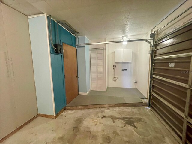 1415 Harnden Rd W, Port Orange, FL 32129 - garage featuring baseboards