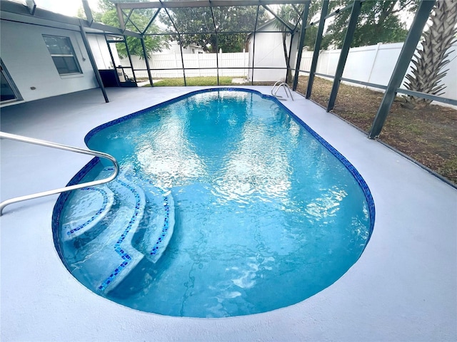 1415 Harnden Rd W, Port Orange, FL 32129 - view of pool featuring glass enclosure, a fenced in pool, a fenced backyard, and a patio area
