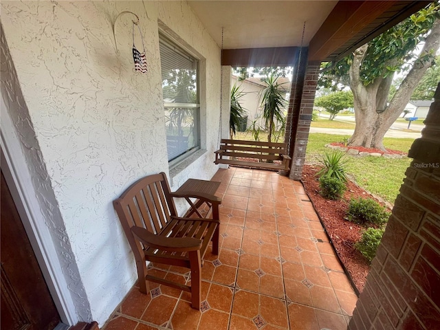 1415 Harnden Rd W, Port Orange, FL 32129 - view of patio / terrace with covered porch