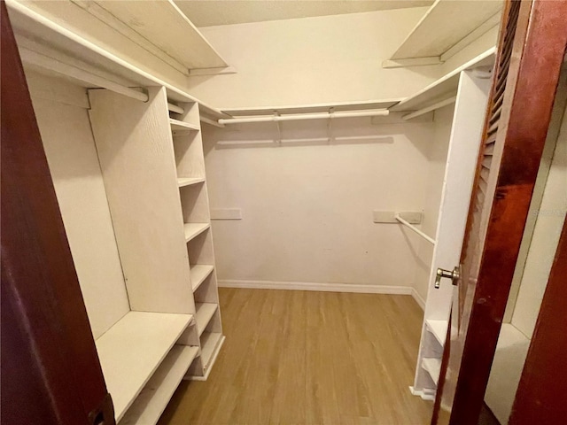 1415 Harnden Rd W, Port Orange, FL 32129 - walk in closet featuring wood finished floors