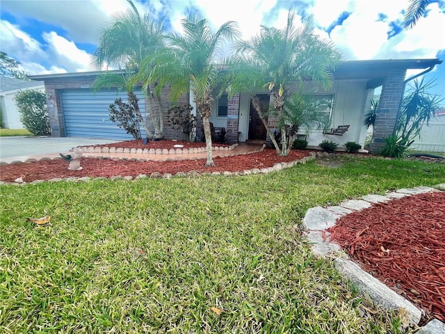 1415 Harnden Rd W, Port Orange, FL 32129 - view of front of property featuring an attached garage and a front lawn
